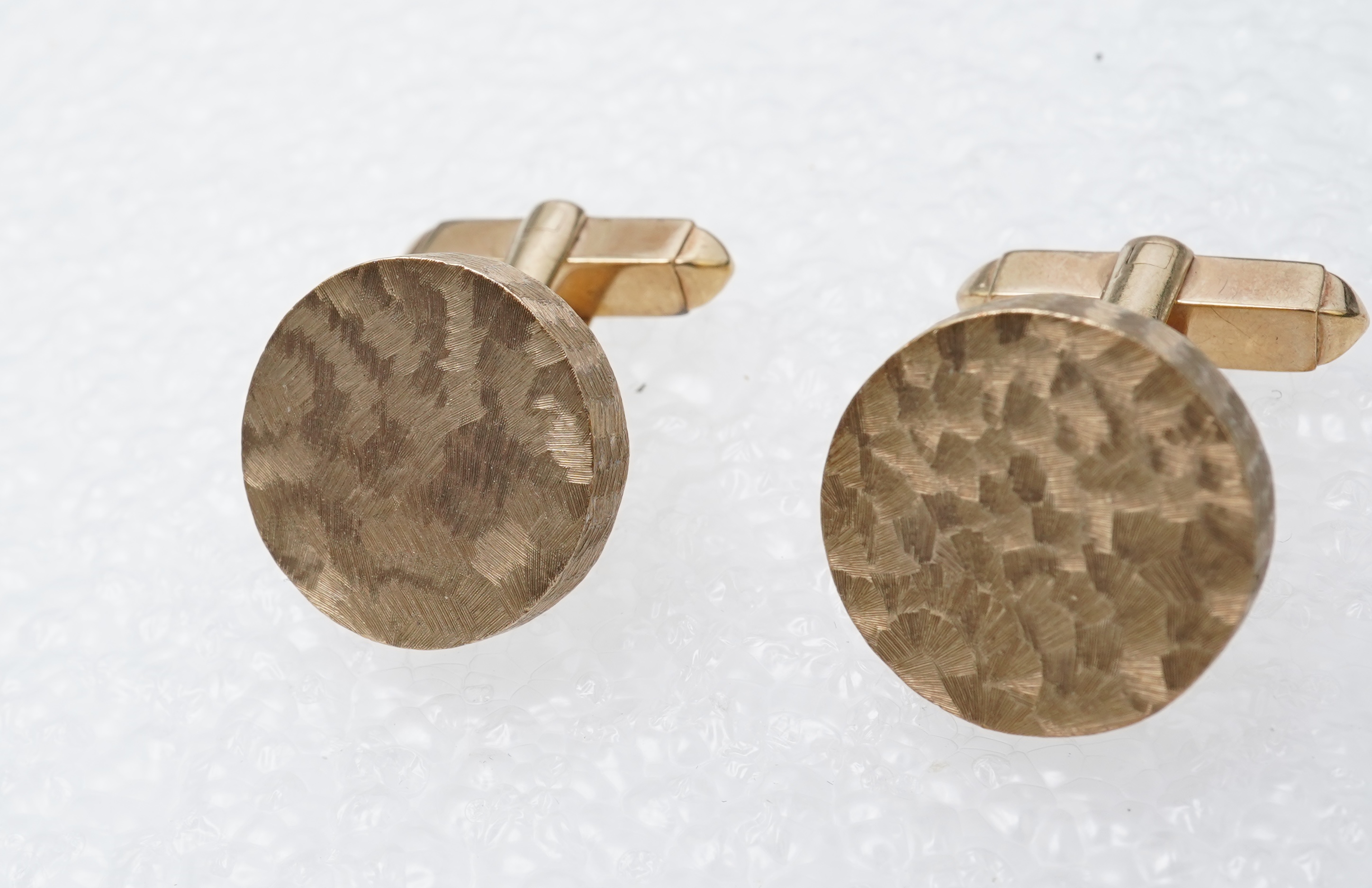 A pair of gold cufflinks, circa 1964
